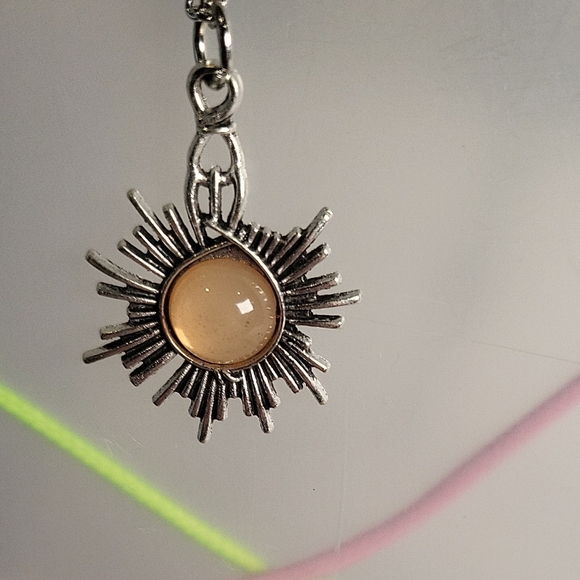 Jewelry - Elegant Silver Sunburst Pendant Necklace with Beige Stone